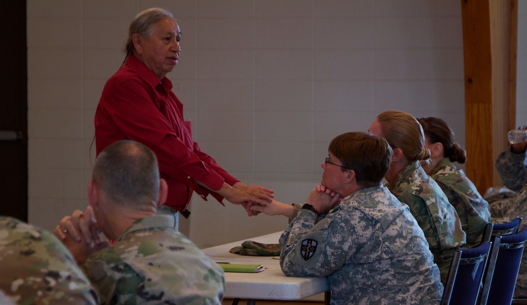 Albert Foote Sr., an elder Native American from Poplar, Montana was invited to give a cultural orientation briefing by the Fort Peck Indian Health Service to welcome Soldiers of the 7239th Medical Support Unit, Chattanooga, Tennessee. He explained the local residents’ culture and traditions as they begin their Innovative Readiness Training at the Verne E. Gibbs Clinic at Poplar, July 17, 2017. The more than 30 medical professionals include doctors, nurse practitioners, dentists, dental specialists, nurses, optical lab specialists, pharmacists, pharmacy technicians and lab technicians. Army Reserve Soldiers will work with the Indian Health Service to provide both medical and dental care to the local community.(U.S. Army Reserve photo by Spc. Claudia Rocha 345th Public Affairs Detachment)