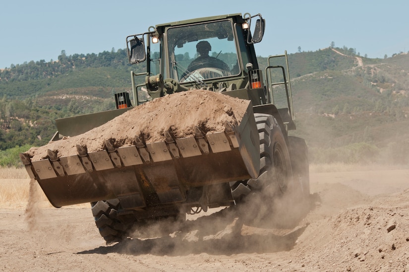 A Reserve Soldier from the the 718th Engineer Company out of Fort Benning, Ga. operates a front-end loader during Combat Support Training Exercise 91-17-03 at Fort Hunter Liggett, Calif., on July 19, 2017. Nearly 5,400 service members from the U.S. Army Reserve, U.S. Army, Army National Guard, U.S. Navy, and Canadian Armed Forces are training at Fort Hunter Liggett, Calif., as part of the 84th Training Command’s CSTX 91-17-03 and ARMEDCOM’s Global Medic; this is a unique training opportunity that allows U.S. Army Reserve units to train alongside their multi-component and joint partners as part of the America’s Army Reserve evolution into the most lethal Federal Reserve force in the history of the nation. (U.S. Army Reserve photo by Sgt. Thomas Crough, 301st Public Affairs Detachment)