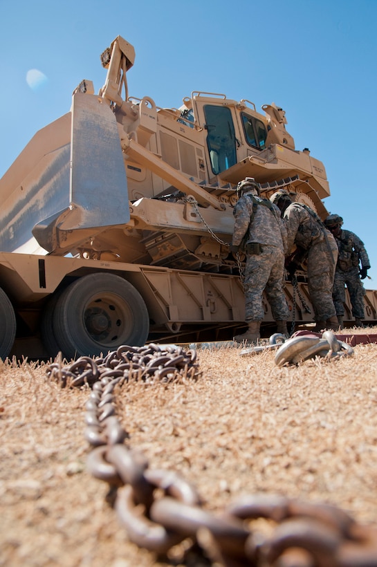 Reserve Soldiers from the 718th Engineer Company out of Fort Benning, Ga. remove chains from a Caterpillar D7R bulldozer during Combat Support Training Exercise 91-17-03 at Fort Hunter Liggett, Calif., on July 19th 2017.  Nearly 5,400 service members from the U.S. Army Reserve, U.S. Army, Army National Guard, U.S. Navy, and Canadian Armed Forces are training at Fort Hunter Liggett, Calif., as part of the 84th Training Command’s CSTX 91-17-03 and ARMEDCOM’s Global Medic; this is a unique training opportunity that allows U.S. Army Reserve units to train alongside their multi-component and joint partners as part of the America’s Army Reserve evolution into the most lethal Federal Reserve force in the history of the nation. (U.S. Army Reserve photo by Sgt. Thomas Crough, 301st Public Affairs Detachment)