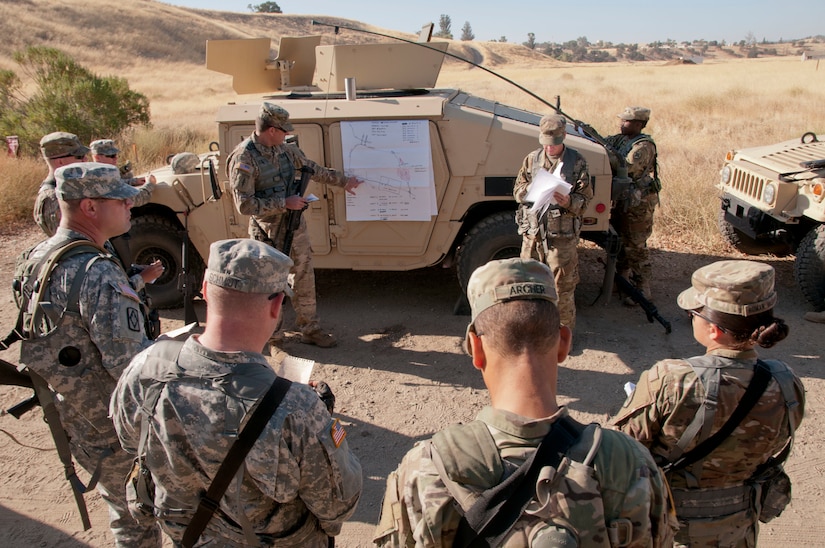 Army Reserve Soldiers from the 949th Transportation Detachment (Movement Control Team) out of Boise, Idaho, listen to a mission brief during Combat Support Training Exercise 91-17-03 at Camp Roberts, Calif., on July 20, 2017. Nearly 5,400 service members from the U.S. Army Reserve, U.S. Army, Army National Guard, U.S. Navy, and Canadian Armed Forces are training at Fort Hunter Liggett, Calif., as part of the 84th Training Command’s CSTX 91-17-03 and ARMEDCOM’s Global Medic; this is a unique training opportunity that allows U.S. Army Reserve units to train alongside their multi-component and joint partners as part of the America’s Army Reserve evolution into the most lethal Federal Reserve force in the history of the nation. (U.S. Army Reserve photo by Sgt. Thomas Crough, 301st Public Affairs Detachment)