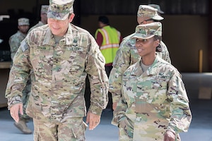 Maj. Gen. Edward Dorman (left), J-4 (logistics), U.S. Central Command, talks with Col. Carmelia Scott-Skillern, commander, 401st Army Field Support Brigade during a tour of an Army Prepositioned Stocks-5 warehouse at Camp Arifjan, Kuwait, July 20. (U.S. Army Photo by Justin Graff, 401st AFSB Public Affairs) (Photo Credit: U.S. Army)