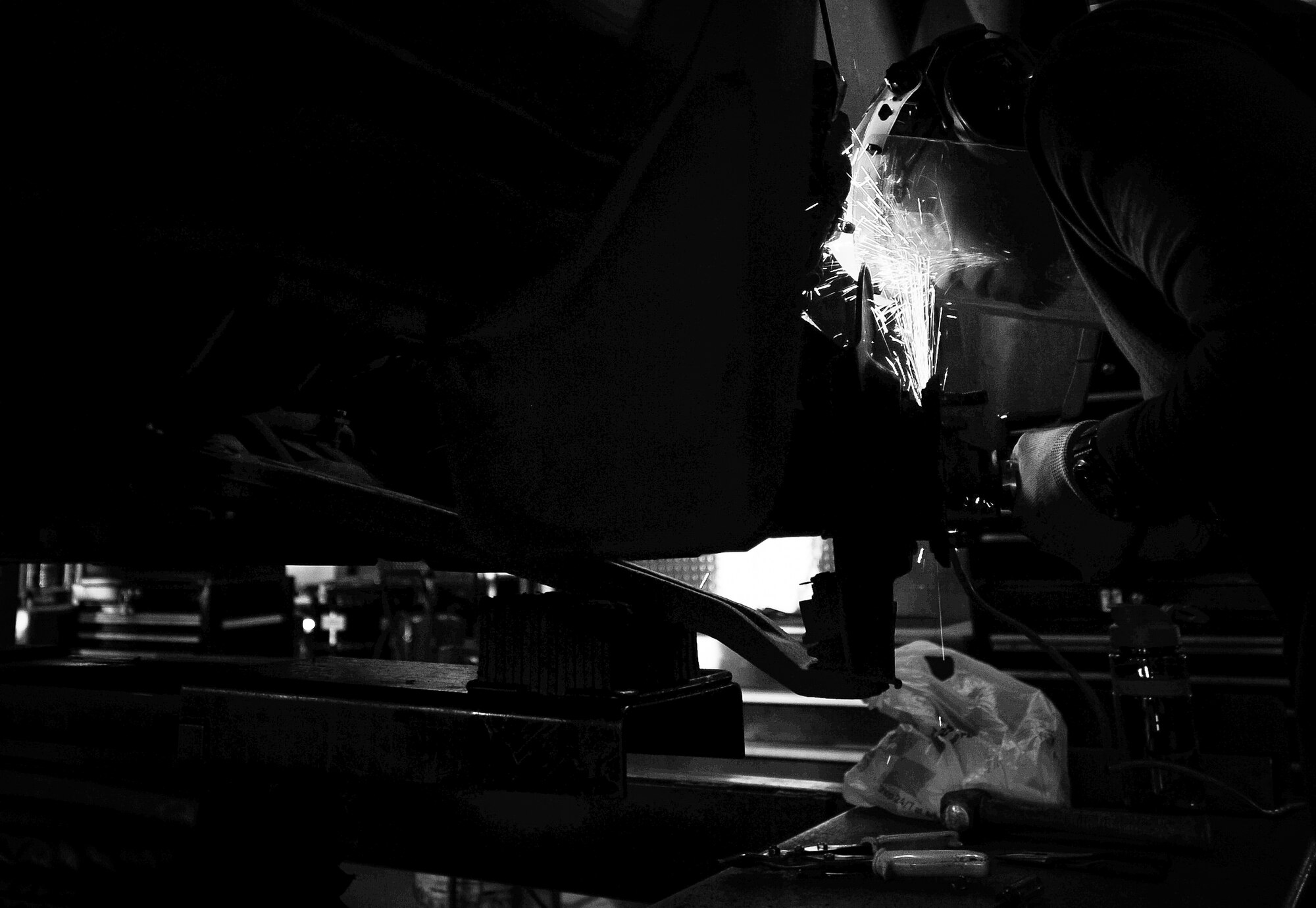 Tech. Sgt. Robert Ivey, 27th Special Operations Civil Engineer Squadron pavement and construction equipment operator, works on his car at the auto hobby shop at Cannon Air Force Base, N.M., Jul. 11, 2017. Airmen visiting the shop are supported with a large array of equipment, some of which are aging. The shop mainly works off hand-me-down equipment from other units and lives off a steady flow of Airmen. (U.S. Air Force photo by Senior Airman Lane T. Plummer)