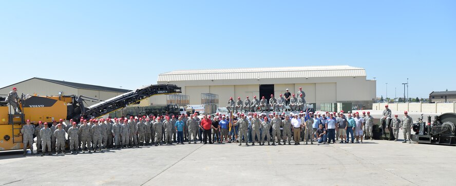 Current and former Airmen from the 819th and 219th RED HORSE Squadrons pose for a photo July 20, 2017, at Malmstrom Air Force Base, Mont. More than 100 Airmen, past and present, joined together for a lunch to reminisce and share their experiences while working in the squadrons. (U.S. Air Force photo/Airman 1st Class Daniel Brosam)