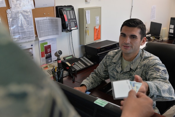 Senior Airman Felipe Vilches-Hernandez, 341st Logistics Readiness Squadron licensing and vehicle operator, assists an Airman in renewing his military vehicle license July 19, 2017, at Malmstrom Air Force Base, Mont. All Airmen operating large vehicles are required to obtain training and a license for accountability and to prevent mishaps. (U.S. Air Force photo/Airman 1st Class Daniel Brosam)