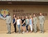 Key spouses from the 944th Security Forces Squadron pose for a photo with Col. Robert Tofil, 944th Fighter Wing vice commander, and Airman and Family Readiness Center staff members July 9 at Luke Air Force Base, Arizona. Key spouses work closely with unit leaders to bring important information to the families and voice their concerns to the unit leaders. (U.S. Air Force photo by Tech. Sgt. Nestor Cruz)