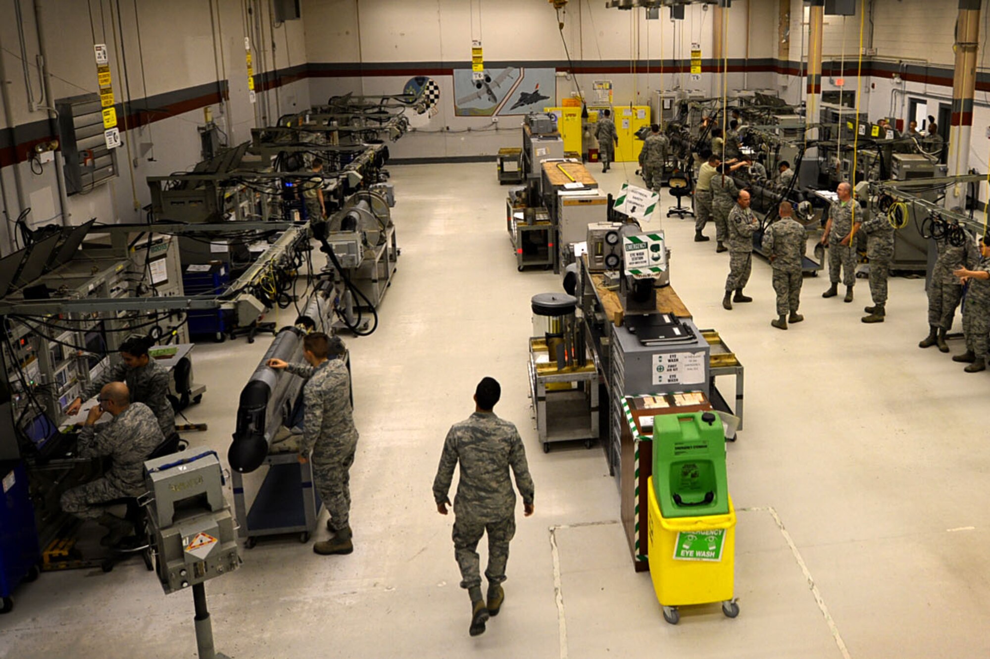 U.S. Airmen assigned to the 20th Component Maintenance Squadron (CMS) electronic warfare (EW) flight perform maintenance on AN/ALQ-184 electronic countermeasure (ECM) pods at the EW work center at Shaw Air Force Base, S.C., July 21, 2017. The 20th CMS EW flight performs maintenance on ECM pods 24-hours a day, ensuring the pods can be sent out to the flightline for installation onto aircraft whenever needed. (U.S. Air Force photo by Senior Airman Christopher Maldonado)