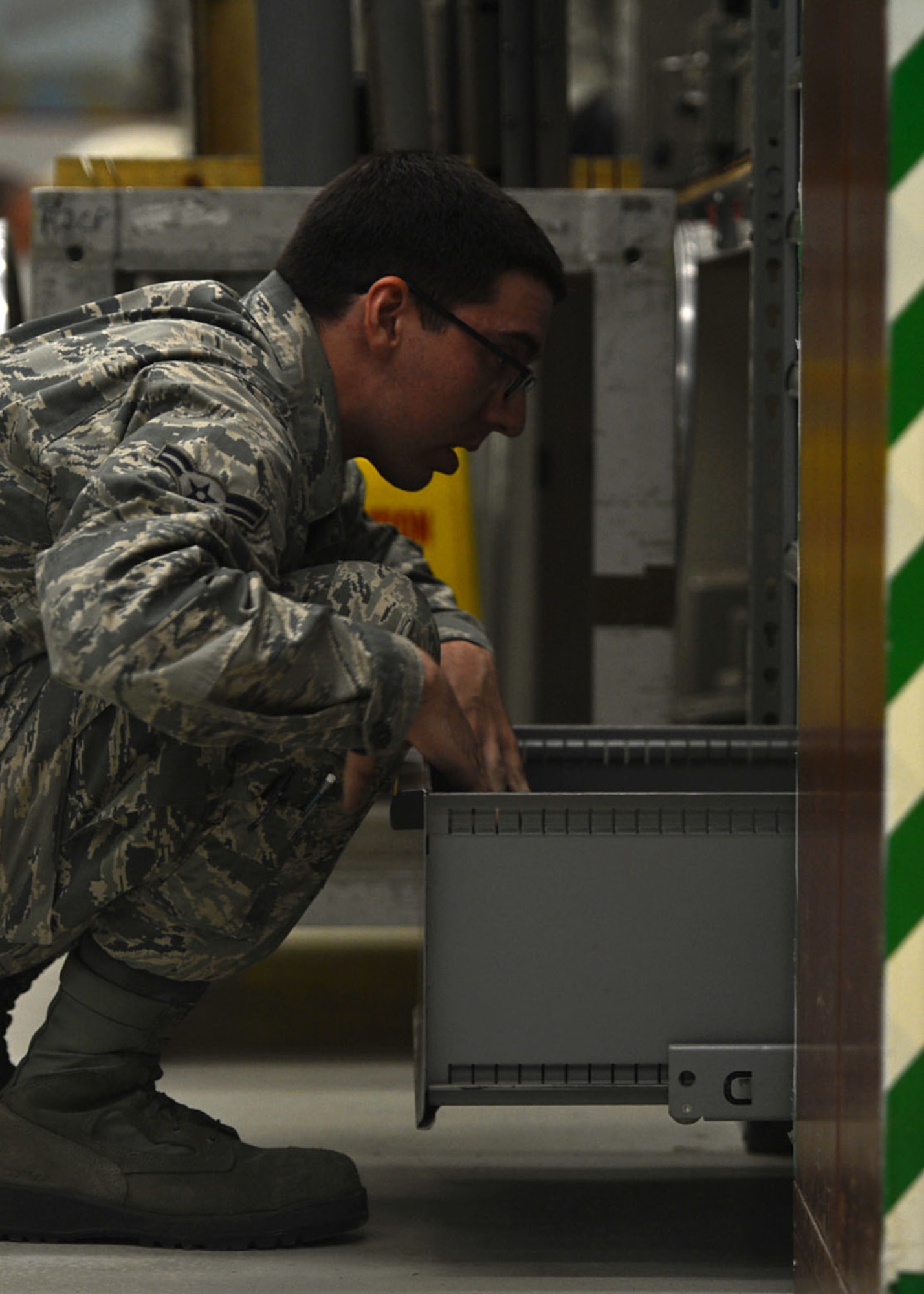 U.S. Air Force Airman 1st Class Layne Jennings, 20th Component Maintenance Squadron (CMS) electronic warfare (EW) team member, searches for tools at the EW work center at Shaw Air Force Base, S.C., July 21, 2017. Airmen assigned to the 20th CMS EW flight utilize a variety of tools to include, digital multimeters, torque wrenches and scatter network machines. (U.S. Air Force photo by Senior Airman Christopher Maldonado)