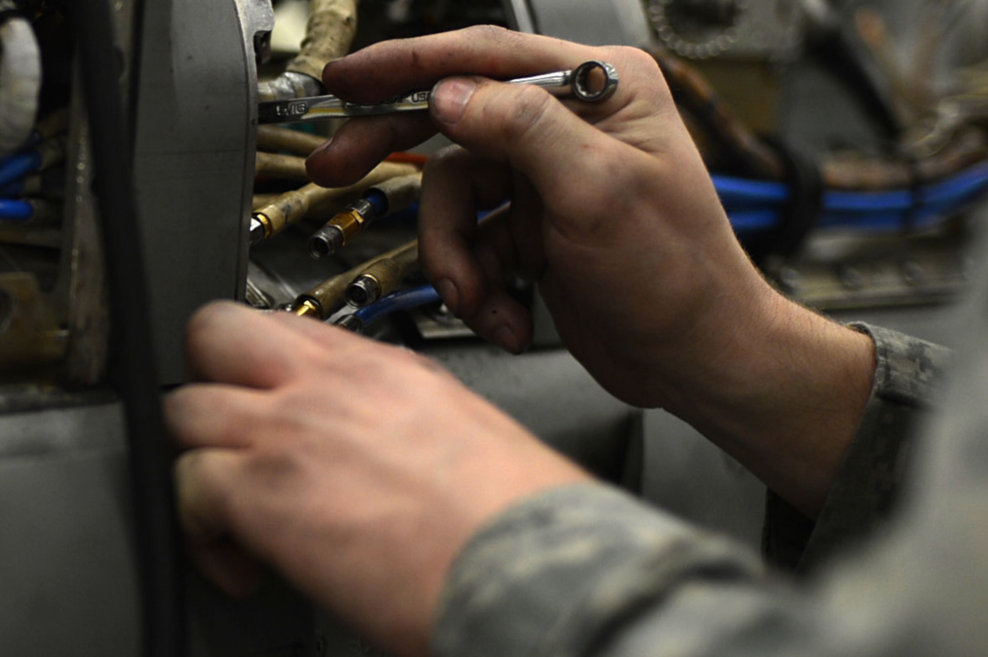U.S. Air Force Senior Airman Joshua Boyd, 20th Component Maintenance Squadron (CMS) electronic warfare (EW) team member, uses a wrench to perform maintenance on an AN/ALQ-184 electronic countermeasure pod at the EW work center at Shaw Air Force Base, S.C., July 21, 2017. Airmen assigned to the 20th CMS EW work center inspect the pods every 120 days to ensure they are functioning properly to deter incoming surface-to-air missiles. (U.S. Air Force photo by Senior Airman Christopher Maldonado)