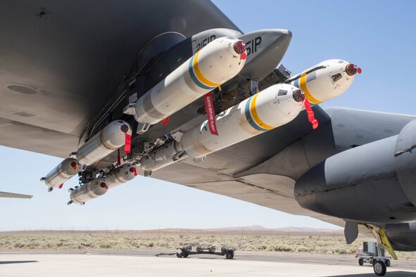 A B-52 Stratofortress assigned to the 419th Flight Test Squadron is loaded with eight PDU-5/B leaflet bombs underneath the left wing June 21, 2017. The PDU-5/B is a repurposed Cluster Bomb Unit used to release leaflets (paper cut into a specific size). Leaflets are generally dropped during U.S. military psychological operations overseas. (U.S. Air Force photo/Christopher Okula)