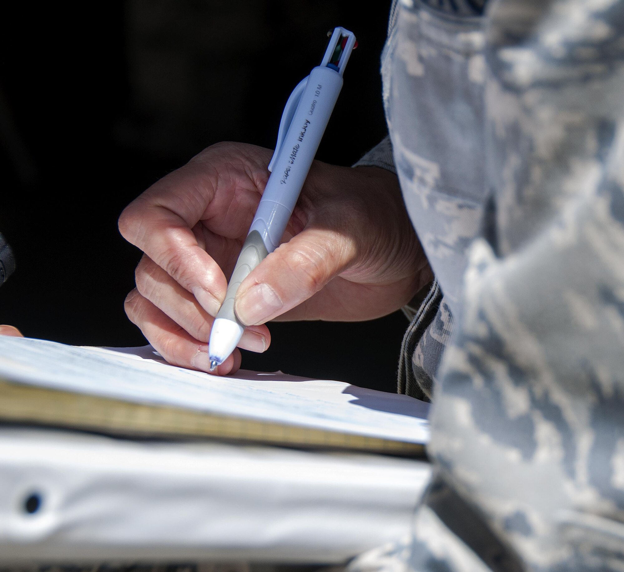 A member of the 349th Air Mobility Wing wing inspection team marks notes while observing the Aeromedical Staging Squadron during Patriot Wyvern at Travis Air Force Base, Cali., on July 22, 2017. The 349th ASTS members had one hour to set up an En-Route Patient Staging Facility and accomplished their task in less than 30 minutes. (U.S. Air Force photo by Staff Sgt. Daniel Phelps)