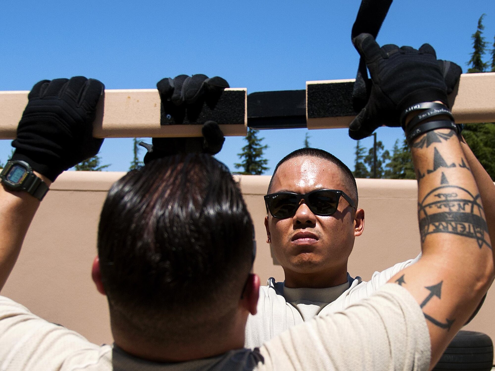 Tech. Sgt. Peter Sampayan, 349th Aeromedical Staging Squadron logistics technician, helps put together an En-Route Patient Staging Facility as part of a unit evaluation inspection for Patriot Wyvern at Travis Air Force Base, Cali., on July 22, 2017. The 349th ASTS members had one hour to set up the ERPSF and set up communicatios. They accomplished their task in less than 30 minutes. (U.S. Air Force photo by Staff Sgt. Daniel Phelps)