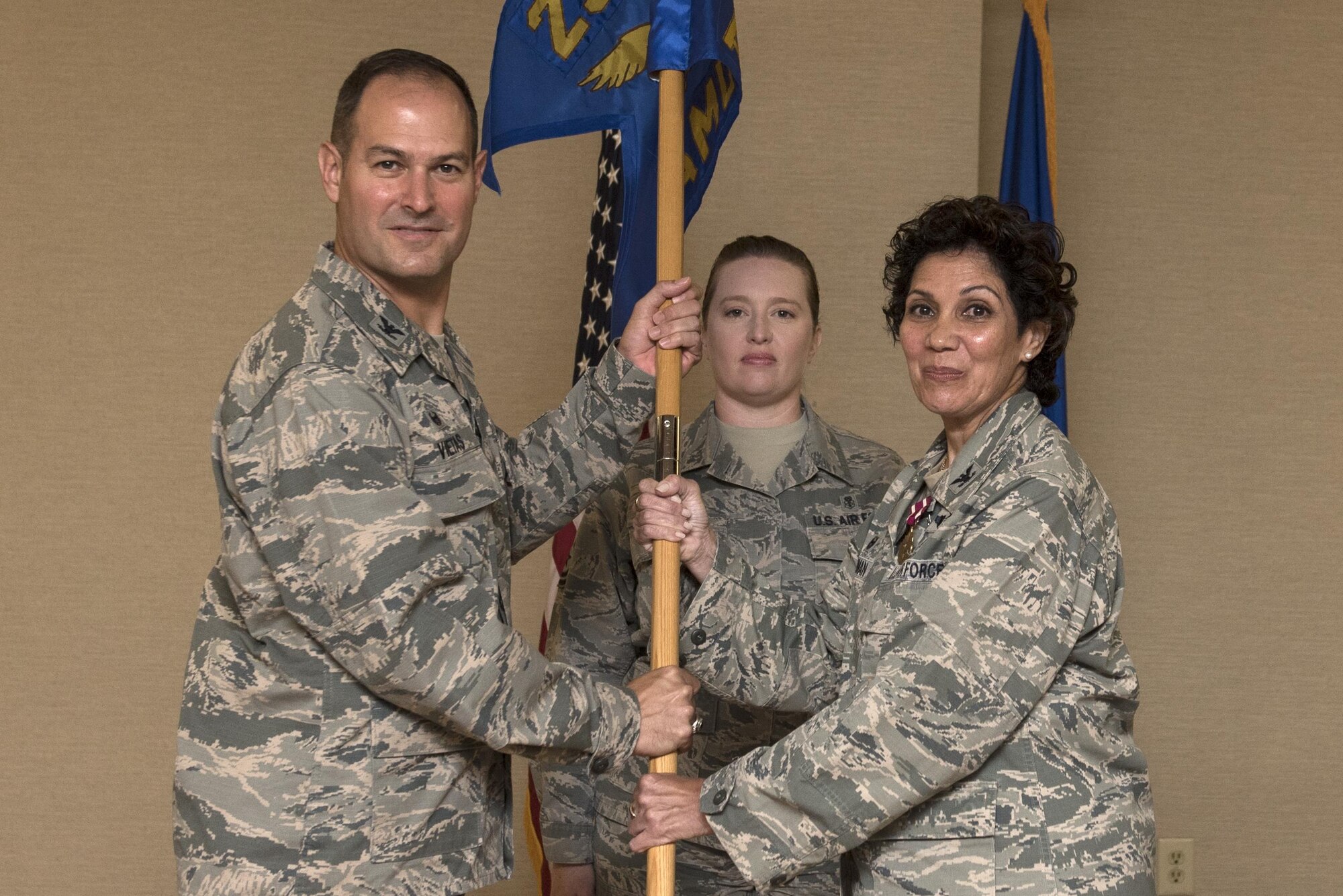 Col. Jay Vietas, left, 23d Medical Group commander, receives the guidon from Col. Yvette Guzman, outgoing 23d Aerospace Medicine Squadron commander, during a change of command ceremony, July 20, 2017, at Moody Air Force Base, Ga. Guzman will assume command at Kirkland AFB, New Mexico, where she will serve as the Chief of the Inspection and Training Division. (U.S. Air Force photo by Airman 1st Class Destiney Masse)