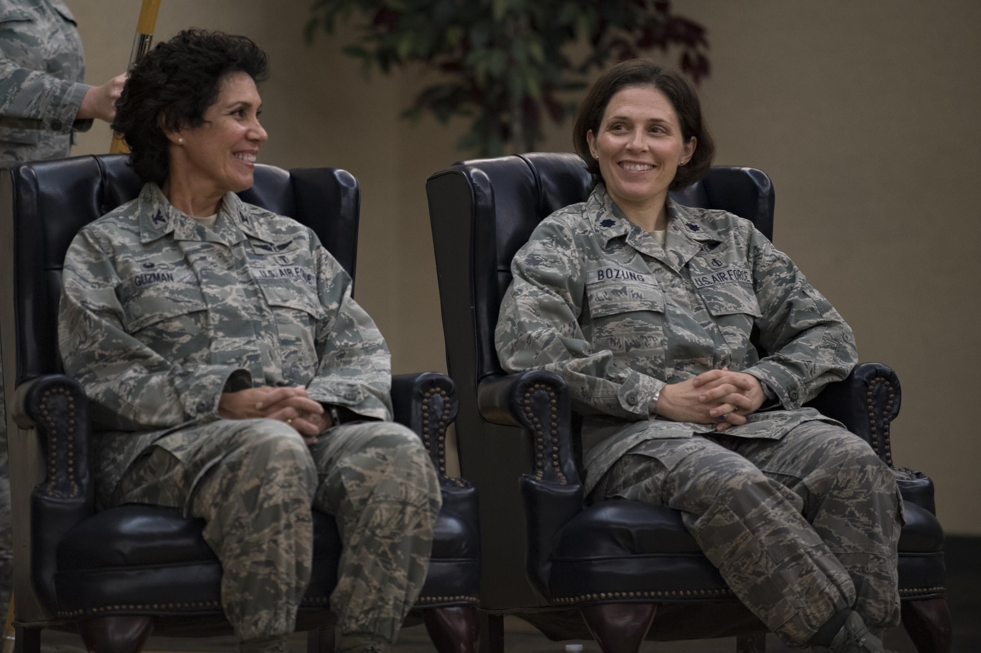 Col. Yvette Guzman, outgoing 23d Aerospace Medicine Squadron commander, shares a laugh with Lt. Col. Tracy Bozung, incoming 23d Aerospace Medicine Squadron commander, during their change of command ceremony, July 20, 2017, at Moody Air Force Base, Ga. The 23d AMDS consists of approximately 90 healthcare professionals who are organized into four flights providing services to include Flight and Base Operational Medicine, Optometry, Aerospace Physiology, Dentistry, Bioenvironmental Engineering and Public Health. (U.S. Air Force photo by Airman 1st Class Daniel Snider)