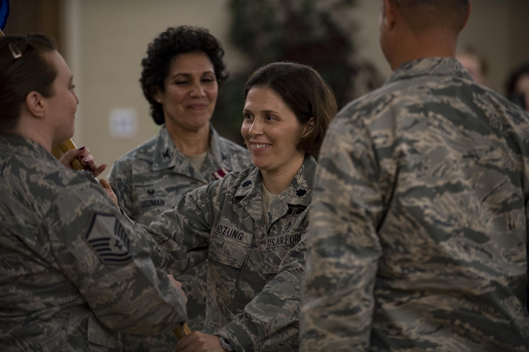 Lt. Col. Tracy Bozung, 23d Aerospace Medicine Squadron commander, receives the guidon signifying her assumption of command, July 20, 2017, at Moody Air Force Base, Ga. The 23d AMDS oversees the individual medical readiness of approximately 4,000 active-duty members and the occupational health of roughly 5,500 industrial workers. (U.S. Air Force photo by Airman 1st Class Daniel Snider)