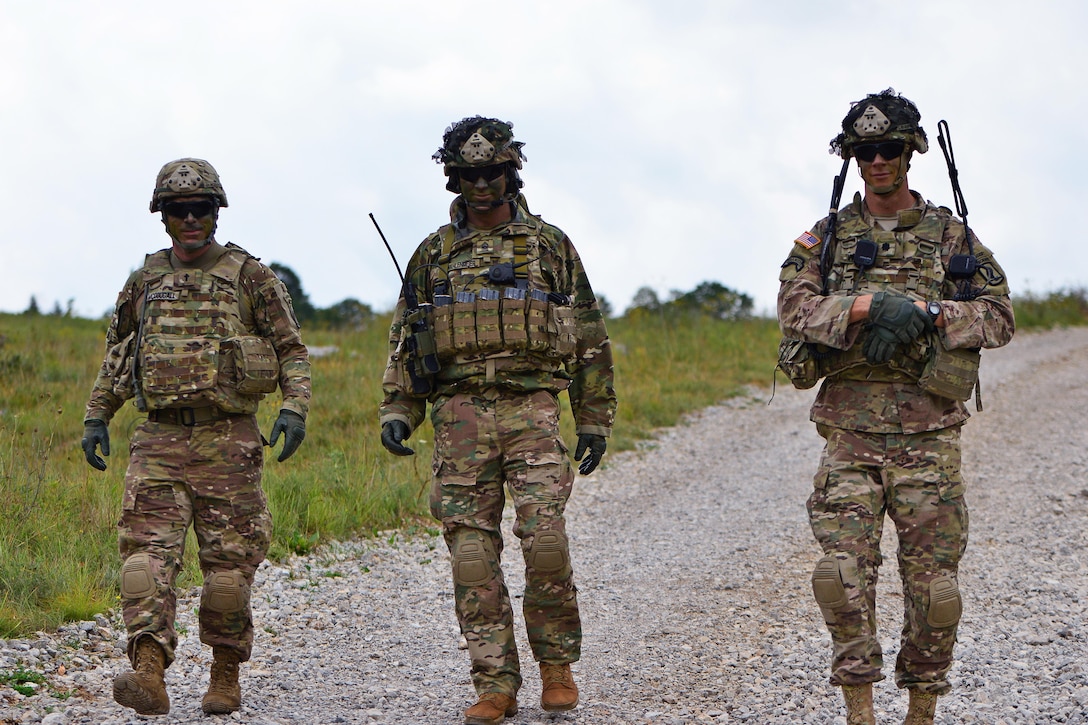 Army Lt. Col. Jim D. Keirsey, left, commander of 2nd Battalion, 503rd Infantry Regiment, 173rd Airborne Brigade talks with Army Command Sgt. Maj. Wayne W. Wahlenmeier, center, and Army Chaplain (Capt.) John P. Mcdougall, right, during Exercise Rock Knight at Pocek Range in Postonja, Slovenia, July 24, 2017. Army photo by Davide Dalla Massara