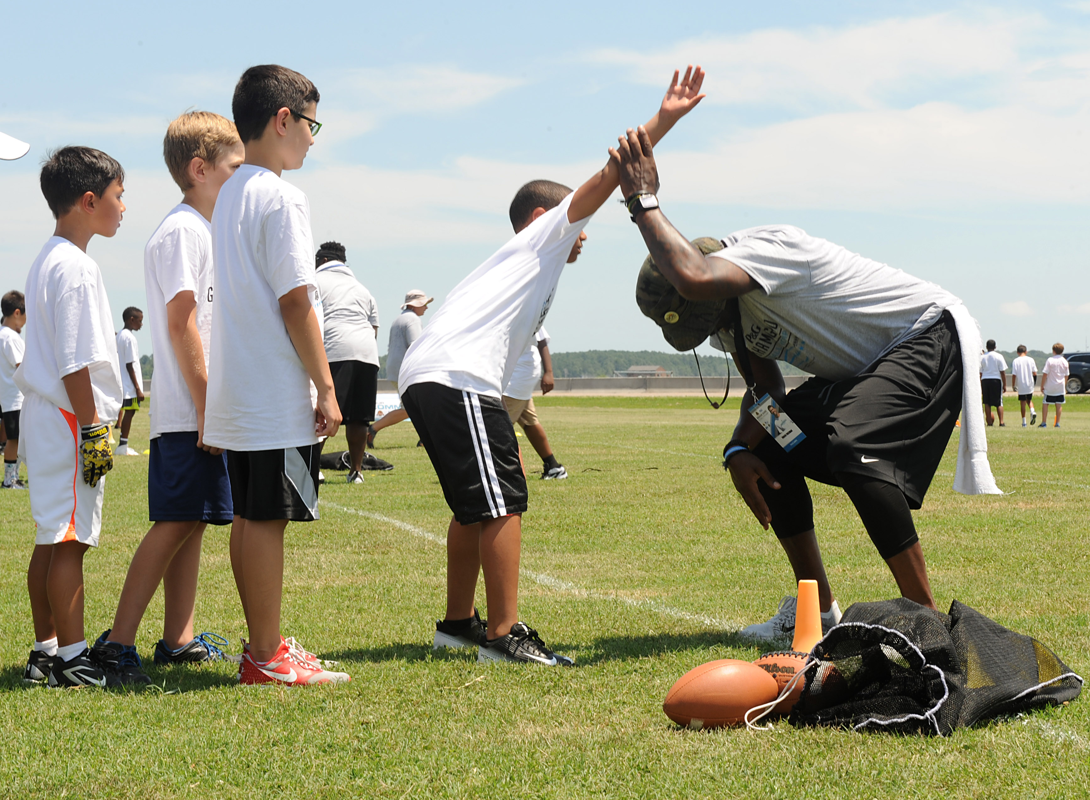 NFL player hosts military youth football camp 