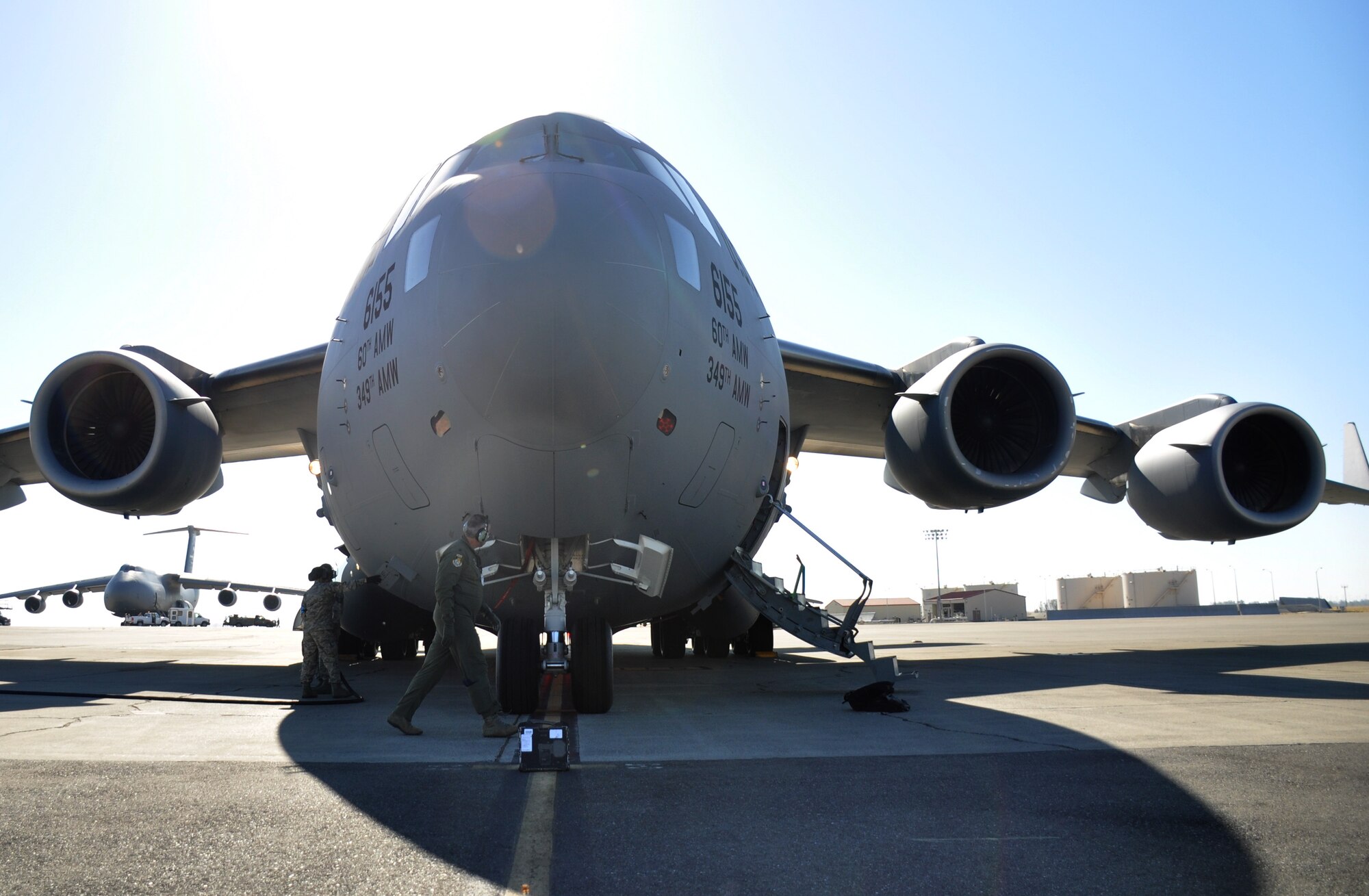 Lt. Col. William Wickersham, 301st Airlift Squadron C-17 Globemaster III pilot, performs a pre-flight inspection July 22, 2017 at Travis Air Force Base, Calif. The aircraft would later perform low-level fying and terrain-masking techniques as part of the 349th Air Mobility Wing's Patriot Wyvern exercise. (U.S. Air Force photo by Senior Airman Shelby R. Horn/Released)