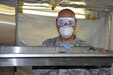 Spc. Christopher Myers, a mortuary affairs specialist with the 311th Quartermaster Company out Ramey Base, Puerto Rico, slides out a shelf within the refrigeration unit inside a Mobile Integrated Remains Collection System at Fort Pickett, Virginia, July 16, 2017. The Army Reserve Soldier is participating in the 2017 Joint Mortuary Affairs Exercise along with active Army Soldiers, the Air Force and Marines.