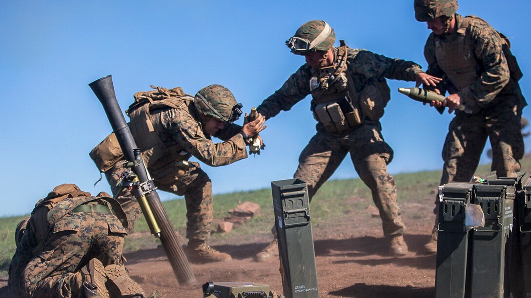 Marines fire an 81 mm mortar during Exercise Talisman Saber 17 at Shoalwater Bay Training Area, Australia, July 21, 2017. The Marines are mortarmen assigned to Weapons Company, Battalion Landing Team, 3rd Battalion, 5th Marine Regiment. The biennial exercise aims to improve the interoperability between Australian and U.S. forces. Marine Corps photo by Lance Cpl. Stormy Mendez