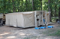 A Mobile Integrated Remains Collection System operated by the 311th Quartermaster Company, an Army Reserve unit out of Ramey Base, Puerto Rico, sits in a training site at Fort Pickett, Virginia, July 16, 2017. The Army Reserve Soldiers are participating in the 2017 Joint Mortuary Affairs Exercise along with active Army Soldiers, the Air Force and Marines.