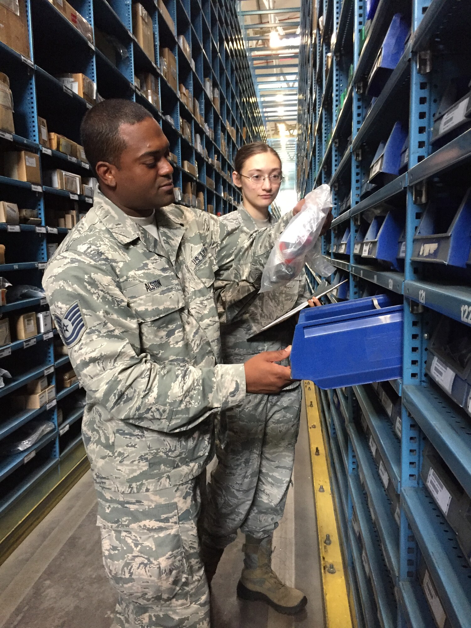 Tech. Sgt. Lucius Alston, a supply specialist from the 927th Logistics Readiness Squadron, MacDill Air Force base, Florida, works alongside his active duty counterpart Senior Airman Heather Vancamp, 52nd Logistics Readiness Squadron, Spangdahlem, Germany. Citizen Airmen from the 927 LRS, traveled to Spangdahlem Air Base, Germany, to perform their annual training, July 7-23, 2017. (U.S. Air Force photo by Tech. Sgt. Peter Dean)