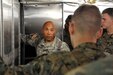 Sgt. 1st Class Luis Burgos, a mortuary affairs collection point NCOIC with the 311th Quartermaster Company out Ramey Base, Puerto Rico, shows a group of mortuary affairs Marines the refrigeration unit inside a Mobile Integrated Remains Collection System at Fort Pickett, Virginia, July 17, 2017. The Army Reserve Soldier is participating in the 2017 Joint Mortuary Affairs Exercise along with active Army Soldiers, the Air Force and Marines.