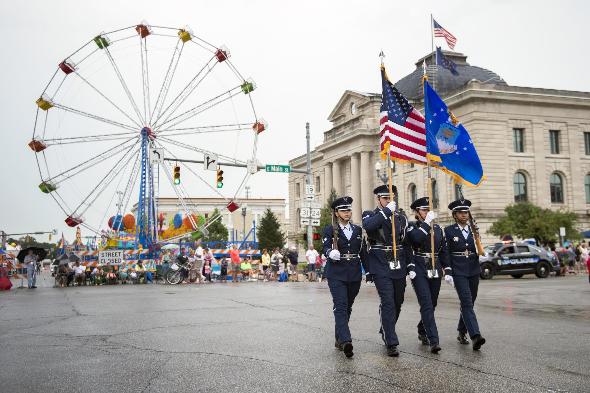Members from Grissom’s honor guard, left to right, Senior Airman Stephanie Briones, Grissom base honor guard manager, Senior Airman Ryan Ware, 49th Aerial Port Flight air transportation specialist, Tech. Sgt. Brandie Bucinski, 434th Aircraft Maintenance Squadron crew chief, and Senior Airman Caresia Baldwin, 434th Logistics Readiness Squadron material management specialist, participate in the Circus City Festival parade in Peru, Indiana July 22, 2017. The parade is the only circus parade in the United States and the second largest parade in Indiana. (U.S. Air Force photo/Tech. Sgt. Benjamin Mota)