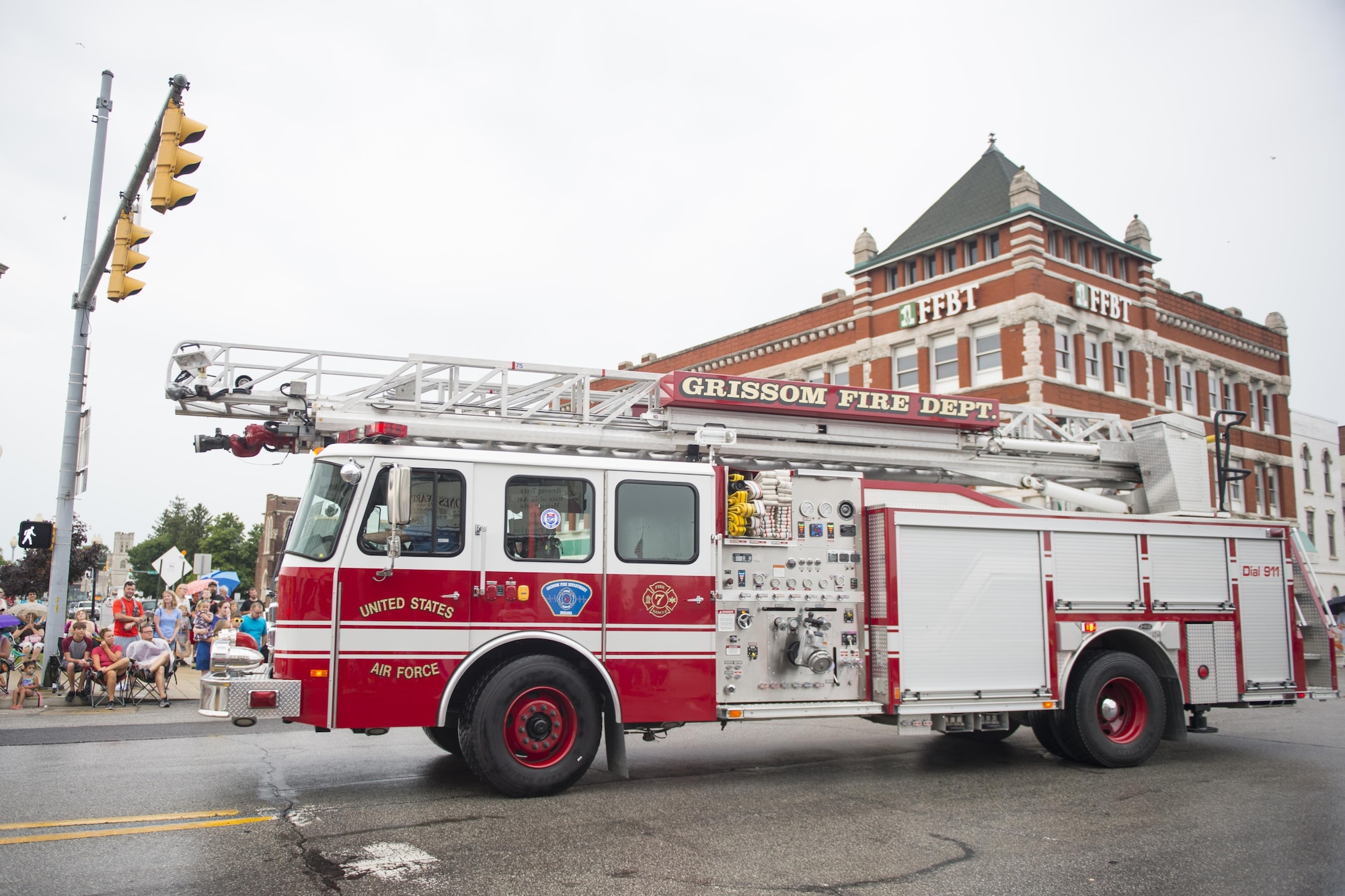 Grissom Air Reserve Base fire department truck ladder 7 maneuvers through the busy streets of Peru, Ind., during the Circus City Festival parade July 22, 2017. In addition to the fire department, members from the 434th Security Forces Squadron, Grissom Base honor guard, 434th Civil Engineer Squadron explosives ordnance disposal flight and Col. Larry Shaw, 434th Air Refueling Wing commander, also participated in this year’s parade. (U.S. Air Force photo/Tech. Sgt. Benjamin Mota)