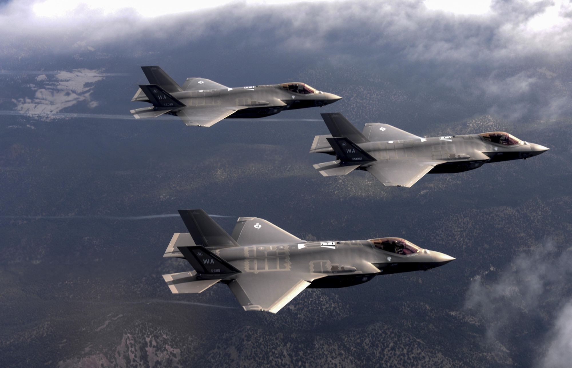 F-35 Lighting II fighter jets, assigned to the 6th Weapons Squadron, at Nellis Air Force Base, Nev., fly over the Nevada Test and Training Range July 10, 2017. The United States Air Force Weapons School teaches graduate-level instructor courses that provide the world's most advanced training in weapons and tactics employment to officers of the combat air forces and mobility air forces. (U.S. Air Force photo by Staff Sgt. Daryn Murphy/Released)