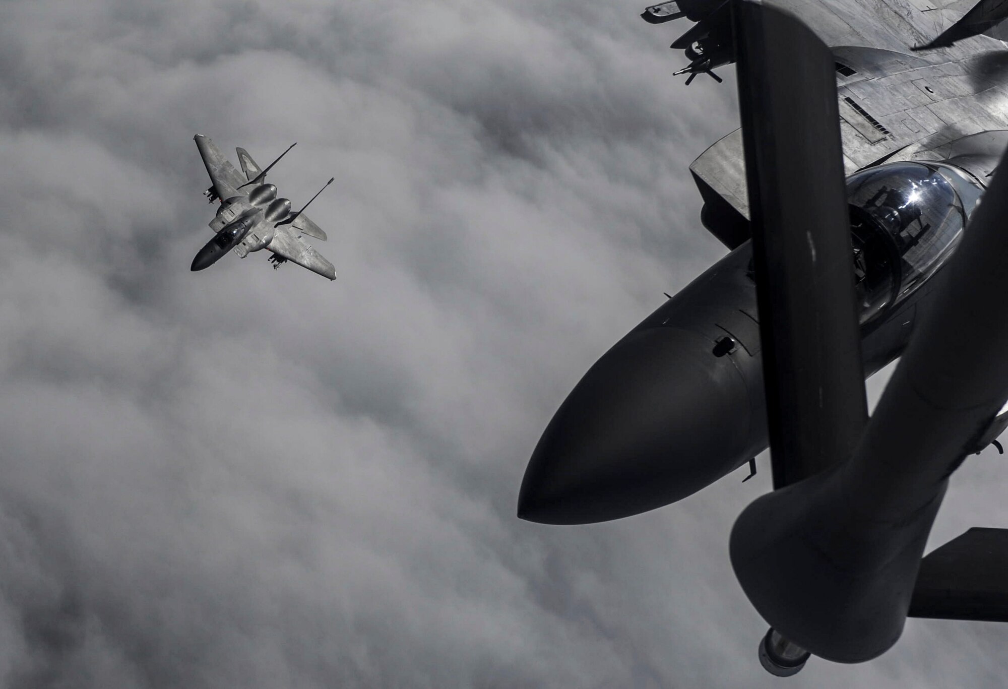 An F-15 fighter jet, assigned to the 433rd Weapons Squadron, at Nellis Air Force Base, prepares for aerial refueling over the Nevada Test and Training Range, Nev., July 10, 2017. The United States Air Force Weapons School teaches graduate-level instructor courses that provide the world's most advanced training in weapons and tactics employment to officers of the combat air forces and mobility air forces. (U.S. Air Force photo by Senior Airman Kevin Tanenbaum/Released)