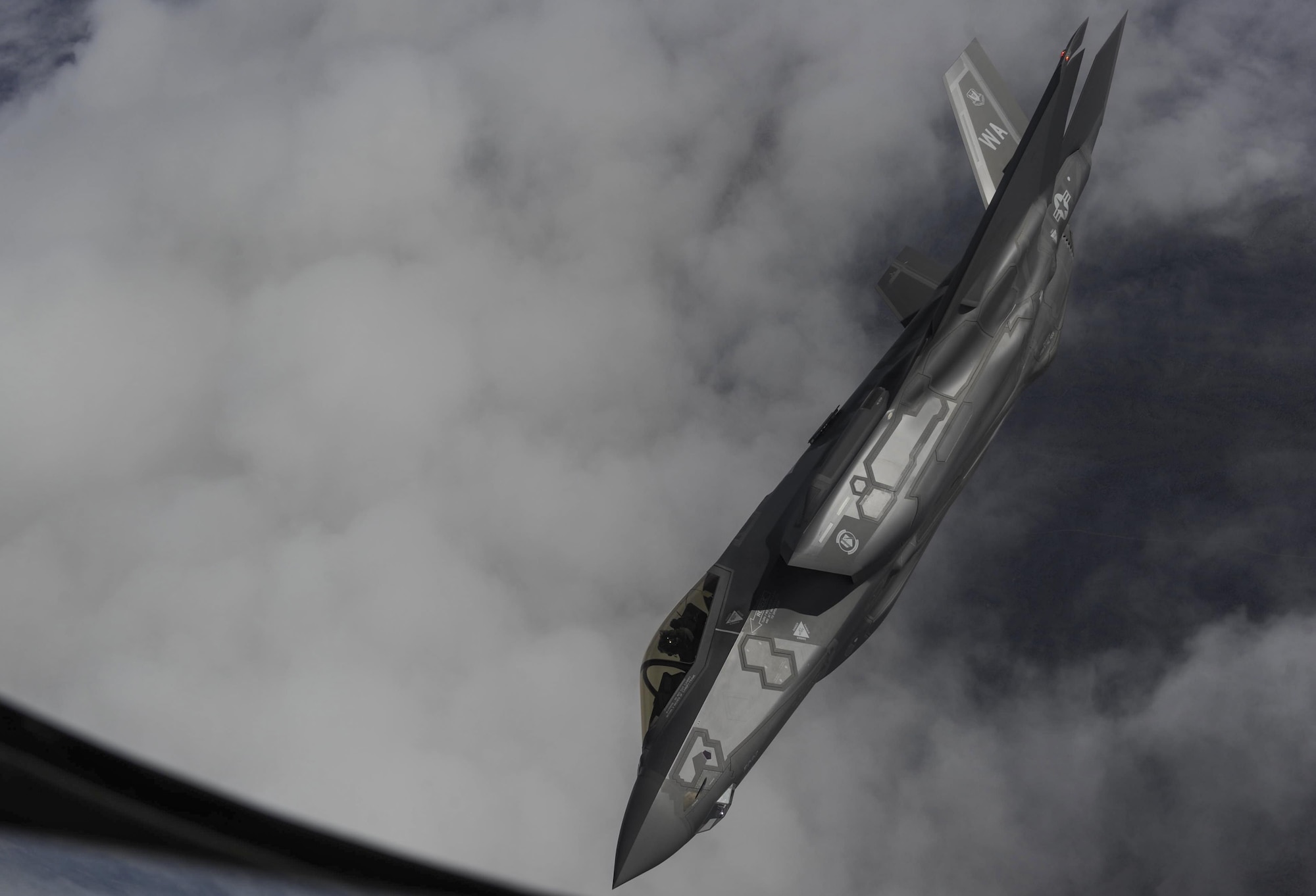 An F-35 Lightning II fighter jet, assigned to the 6th Weapons Squadron, at Nellis Air Force Base, Nev., flies over the Nevada Test and Training Range, Nev., July 10, 2017. The United States Air Force Weapons School teaches graduate-level instructor courses that provide the world's most advanced training in weapons and tactics employment to officers of the combat air forces and mobility air forces. (U.S. Air Force photo by Senior Airman Kevin Tanenbaum/Released)