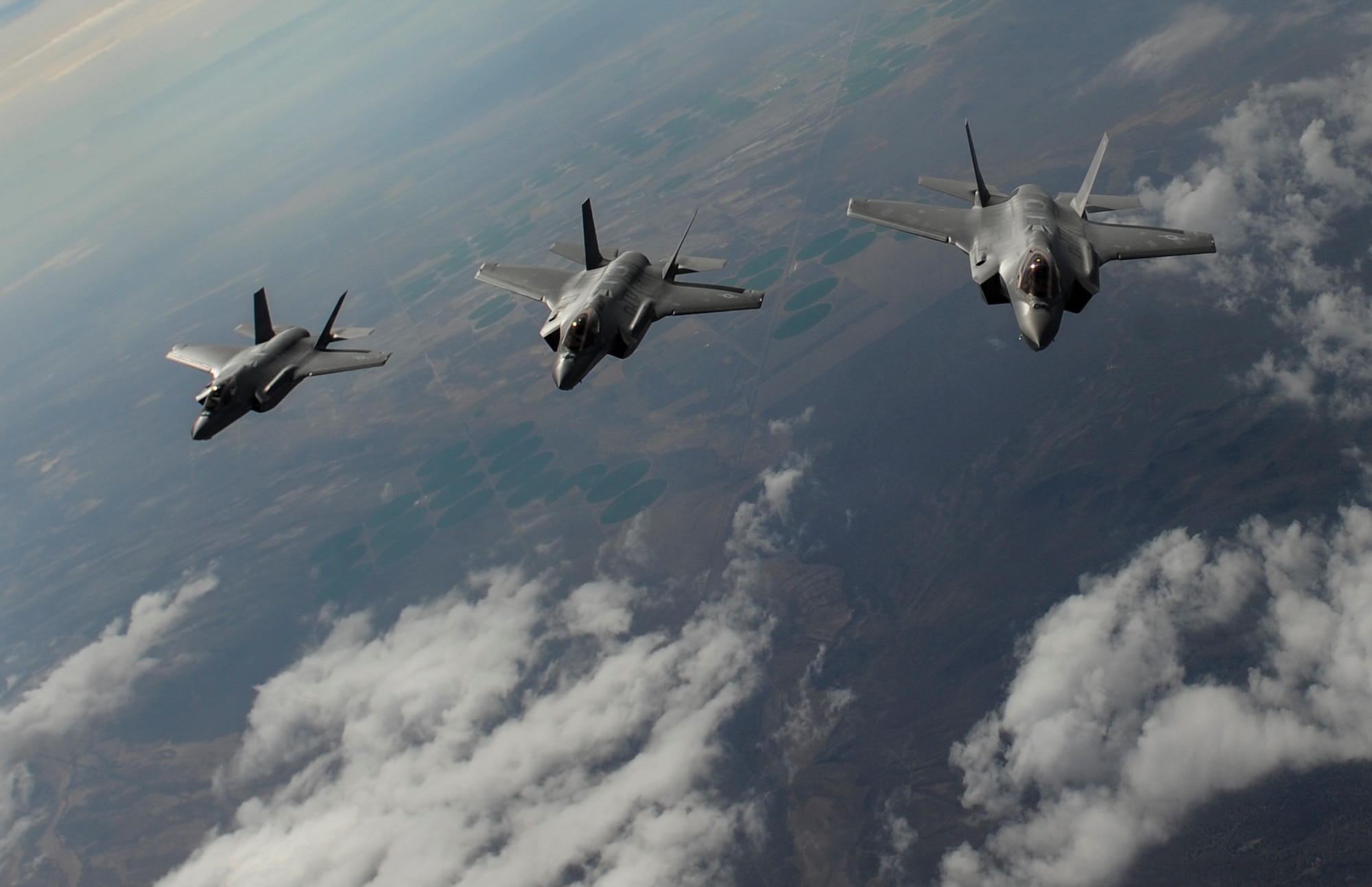 F-35 Lightning II fighter jets, assigned to the 6th Weapons Squadron, at Nellis Air Force Base, Nev., fly in formation over the Nevada Test and Training Range, Nev., July 10, 2017. The United States Air Force Weapons School teaches graduate-level instructor courses that provide the world's most advanced training in weapons and tactics employment to officers of the combat air forces and mobility air forces. (U.S. Air Force photo by Senior Airman Kevin Tanenbaum/Released)