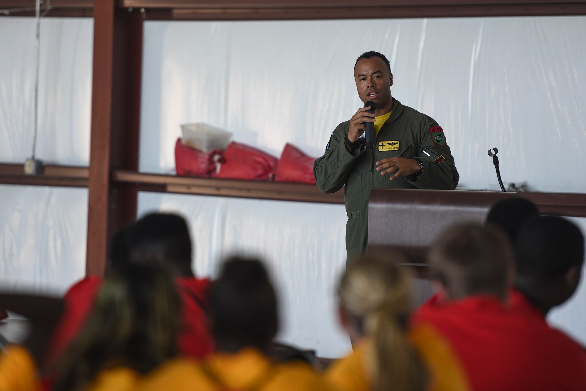 Maj. Aaron Jones, 81st Fighter Squadron AAF flight commander and Legacy Flight Academy event coordinator team member, encourages youth to explore military aviation careers during the Eyes Above the Horizon diversity outreach program, July 22, 2017, in Valdosta, Ga. The Valdosta Regional Airport welcomed approximately 100 10-19-year-olds as they took the Valdosta skies to commemorate the 76th Anniversary of the historic Tuskegee Airmen. The program focuses on mentoring and familiarizing underrepresented minorities with basic flying fundamentals. (U.S. Air Force photo by Senior Airman Greg Nash) 