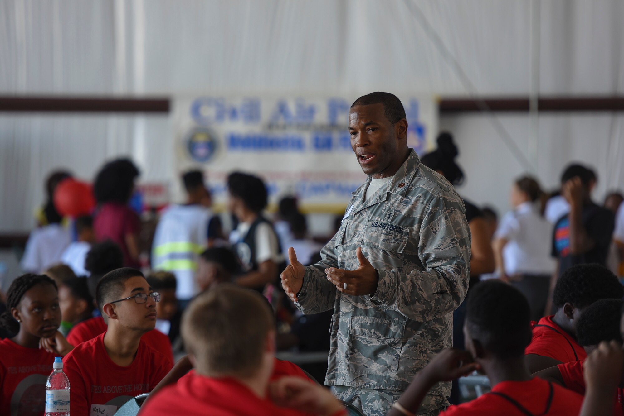 Maj. Sherrod Brown, 23d Aerospace Medicine Squadron Bioenvironmental Engineering commander, briefs the importance of Science, Technology, Engineering and Mathematical academic enrichment to youth during the Eyes Above the Horizon diversity outreach program, July 22, 2017, in Valdosta, Ga. The Valdosta Regional Airport welcomed approximately 100 10-19-year-olds as they took the Valdosta skies to commemorate the 76th Anniversary of the historic Tuskegee Airmen. The program focuses on mentoring and familiarizing underrepresented minorities with basic flying fundamentals. (U.S. Air Force photo by Senior Airman Greg Nash) 