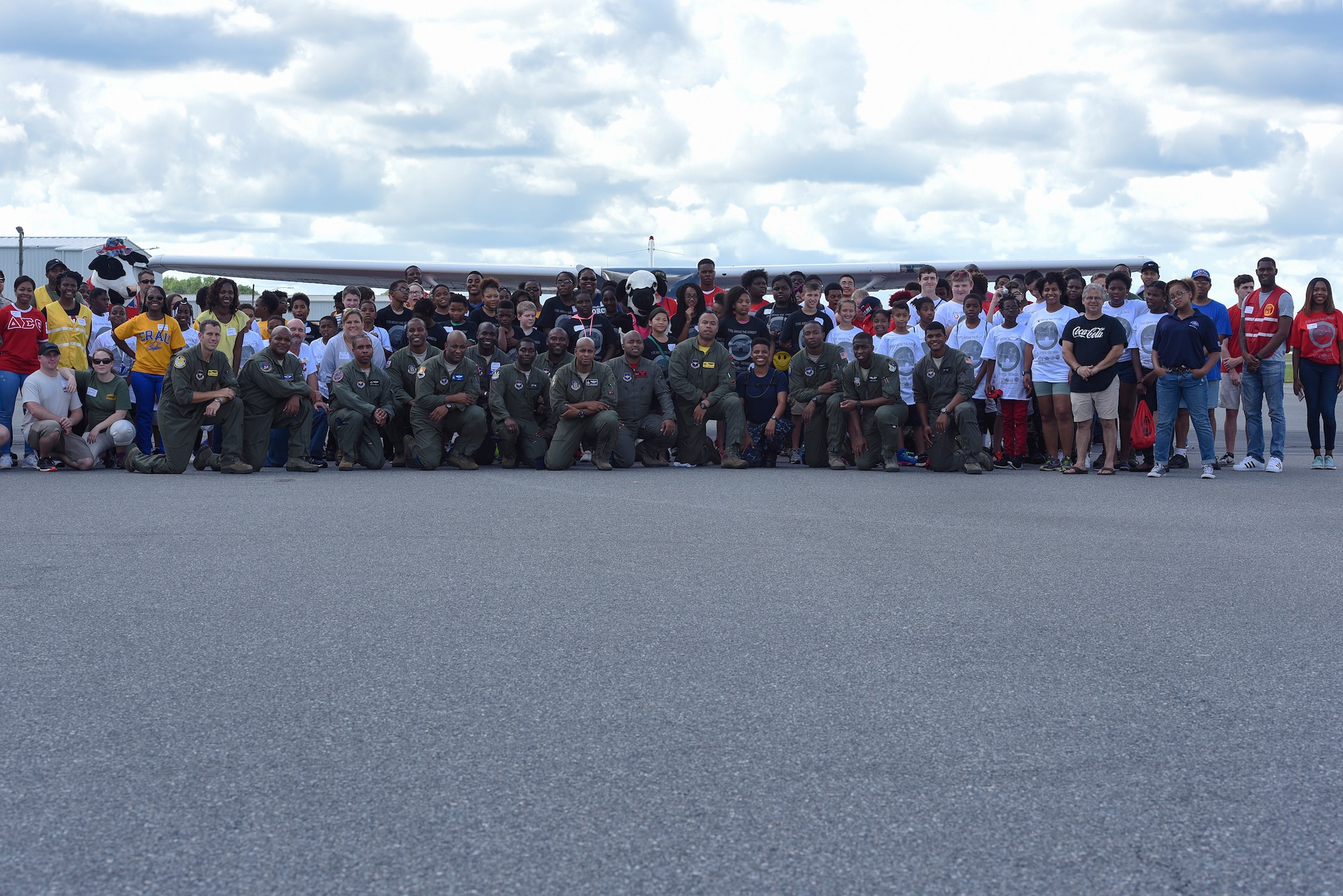 Local youth pose with collegiate advisors and Airmen during the Eyes Above the Horizon diversity outreach program, July 22, 2017, in Valdosta, Ga. Approximately 100 10-19-year-olds learned about aviation as they took the Valdosta skies to commemorate the 76th Anniversary of the historic Tuskegee Airmen. The program focuses on mentoring and familiarizing underrepresented minorities with basic flying fundamentals. (U.S. Air Force photo by Senior Airman Greg Nash)