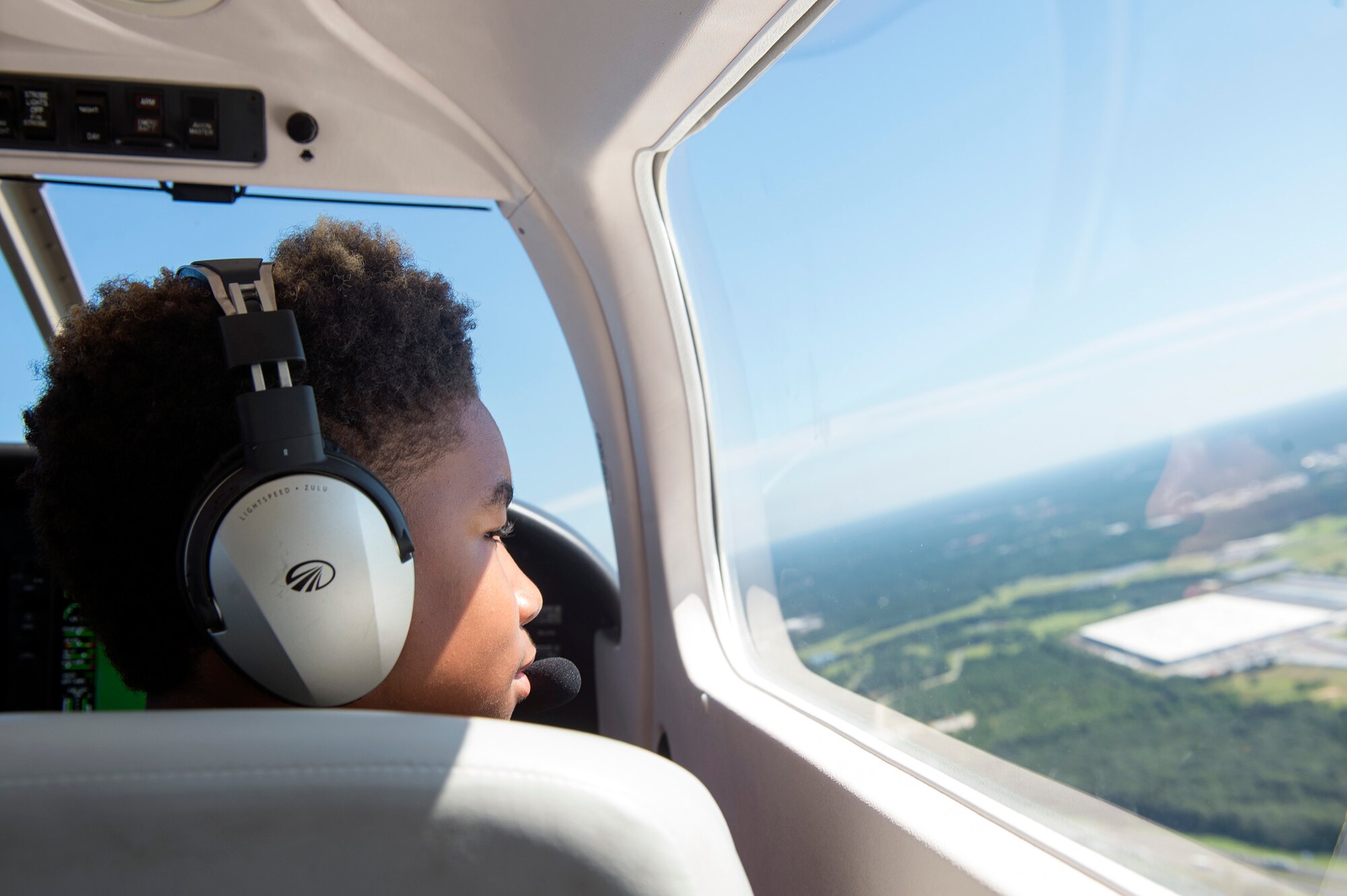 A South Georgian youth overlooks the skies as he co-pilots a Piper Archer aircraft during the Eyes Above the Horizon diversity outreach program, July 22, 2017, in Valdosta, Ga. Moody Airmen, service members nationwide and collegiate representatives taught approximately 100 10-19-year-olds about aviation as they took the Valdosta skies to commemorate the 76th Anniversary of the historic Tuskegee Airmen. The program focuses on mentoring and familiarizing underrepresented minorities with basic flying fundamentals. (U.S. Air Force photo by Senior Airman Greg Nash)