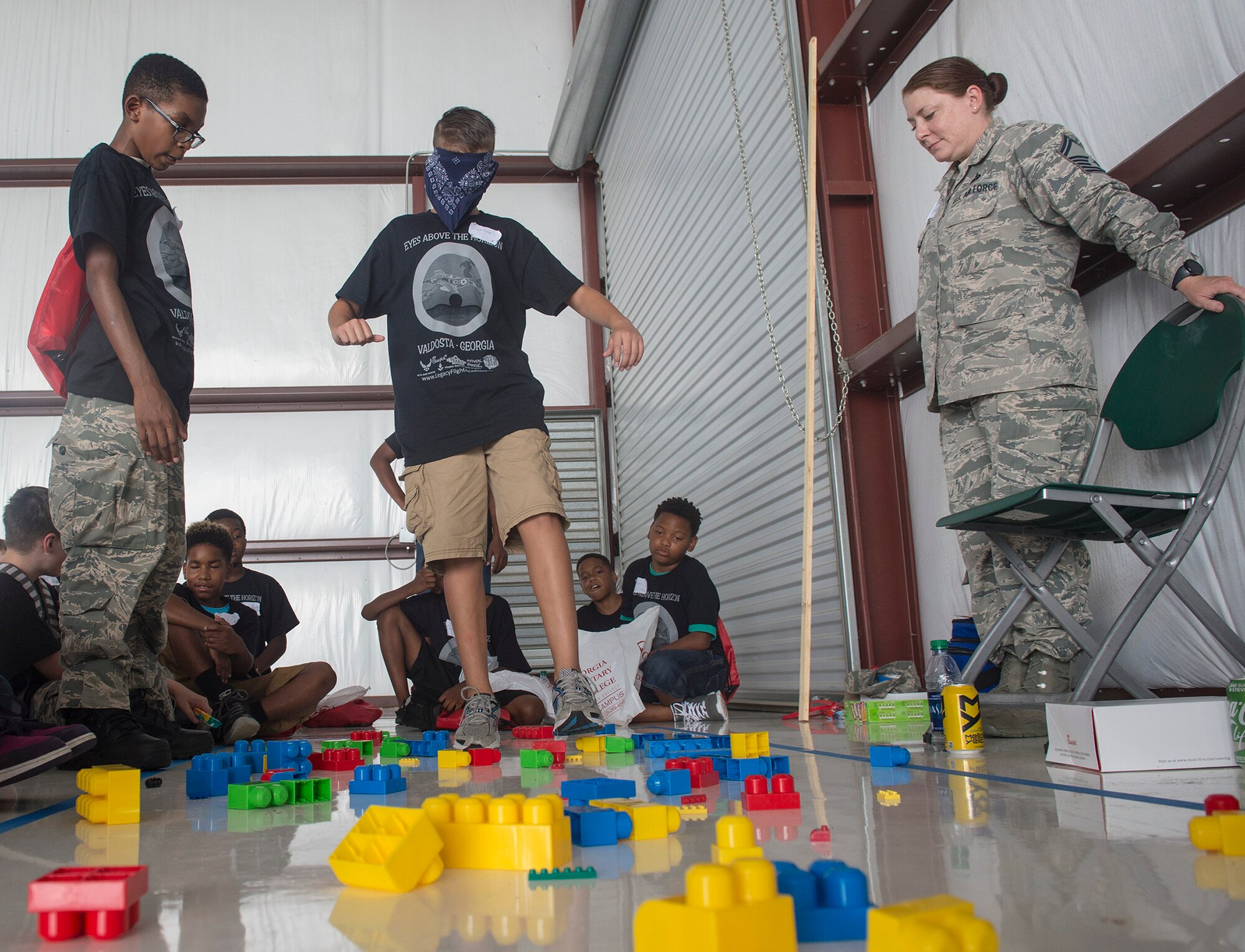 Youth participate in a team-building exercise as a part of the Eyes Above the Horizon diversity outreach program, July 22, 2017, in Valdosta, Ga. The Valdosta Regional Airport welcomed approximately 100 10-19-year-olds as they took the Valdosta skies to commemorate the 76th Anniversary of the historic Tuskegee Airmen. The program focuses on mentoring and familiarizing underrepresented minorities with basic flying fundamentals. (U.S. Air Force photo by Senior Airman Greg Nash) 