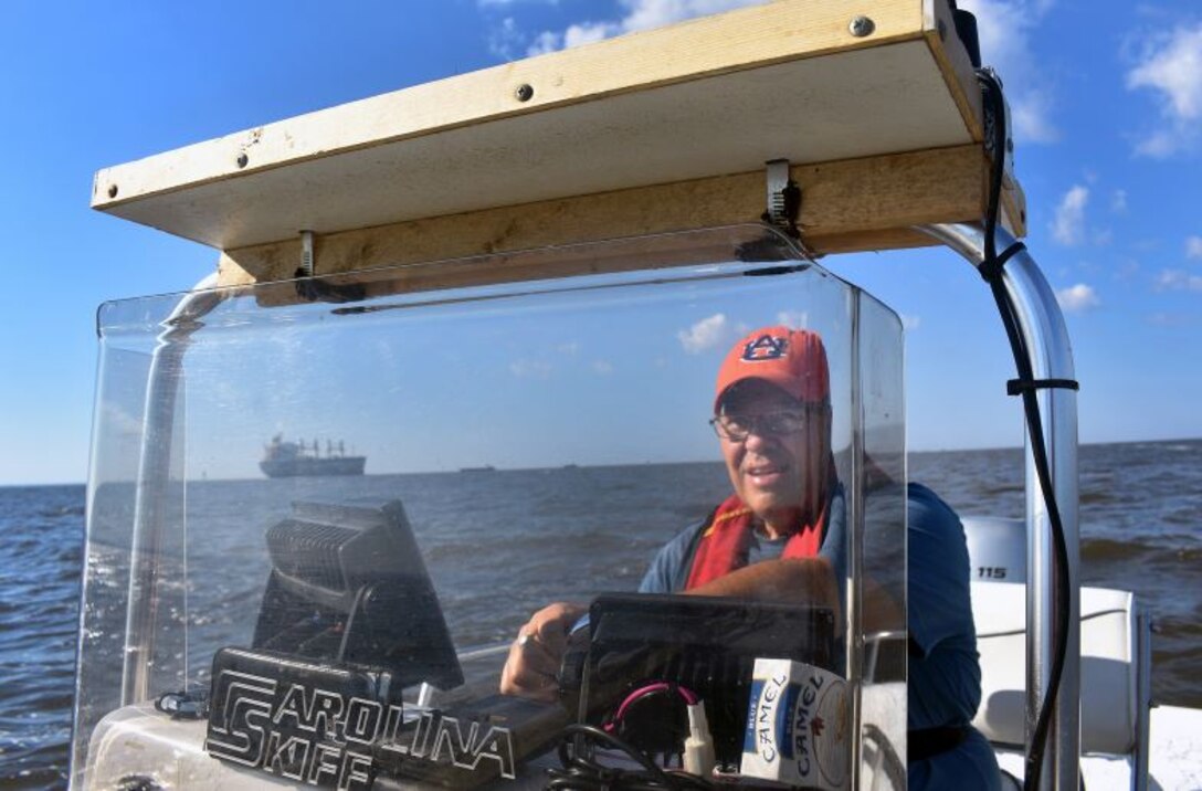 Glenn Duval, of the Mobile District Water Management Division heads out into Mobile Bay for field-data collection, completed for the Mobile Harbor Genera Reevaluation Report. The data includes wetland delineation, seagrass surveys, bottom-dwelling organisms, fisheries and oysters.