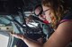 Erin Vermilye, International Association of Chiefs of Police assistant director, discusses the process of in-flight refueling with Tech. Sgt. Matthew Oberlin, 756th Air Refueling Squadron boom operator, inside the boom pod of a KC-135R Stratotanker during a mission near Joint Base Andrews, Maryland, July 21, 2017. The aircraft can carry an additional 220,000 pounds of fuel, allowing the boom operator to fill the tanks of other aircraft in the air, without having to land. (U.S. Air Force photo/ Senior Airman Ryan J. Sonnier)