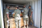 U.S. Marines with several units within the I Marine Expeditionary Force observed a display of how to load and stack a shipping container during Pacific Horizon on Camp Pendleton, Calif., July 12, 2017. Pacific Horizon 2017 is a Maritime Prepositioning Force (MPF) exercise designed to train I Marine Expeditionary Force (I MEF) and components of Naval Beach Group 1 (NBG-1) Marines and Sailors on arrival and assembly operations as well as follow-on Marine Air Ground Task Force actions to ensure that the right equipment, supplies and tools get to the right people to be employed in a crisis response, humanitarian assistance and amassing combat power ashore from sea. (U.S. Marine Corps photo by Lance Cpl. Roxanna Gonzalez)