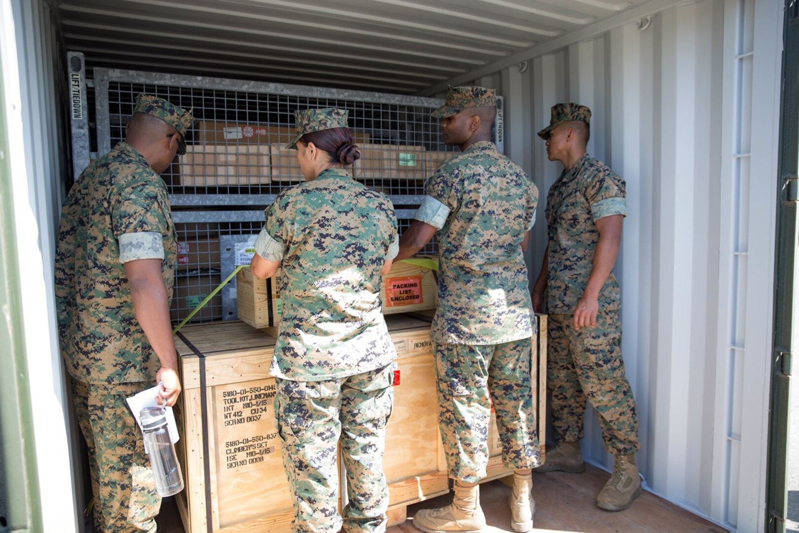 U.S. Marines with several units within the I Marine Expeditionary Force observed a display of how to load and stack a shipping container during Pacific Horizon on Camp Pendleton, Calif., July 12, 2017. Pacific Horizon 2017 is a Maritime Prepositioning Force (MPF) exercise designed to train I Marine Expeditionary Force (I MEF) and components of Naval Beach Group 1 (NBG-1) Marines and Sailors on arrival and assembly operations as well as follow-on Marine Air Ground Task Force actions to ensure that the right equipment, supplies and tools get to the right people to be employed in a crisis response, humanitarian assistance and amassing combat power ashore from sea. (U.S. Marine Corps photo by Lance Cpl. Roxanna Gonzalez)