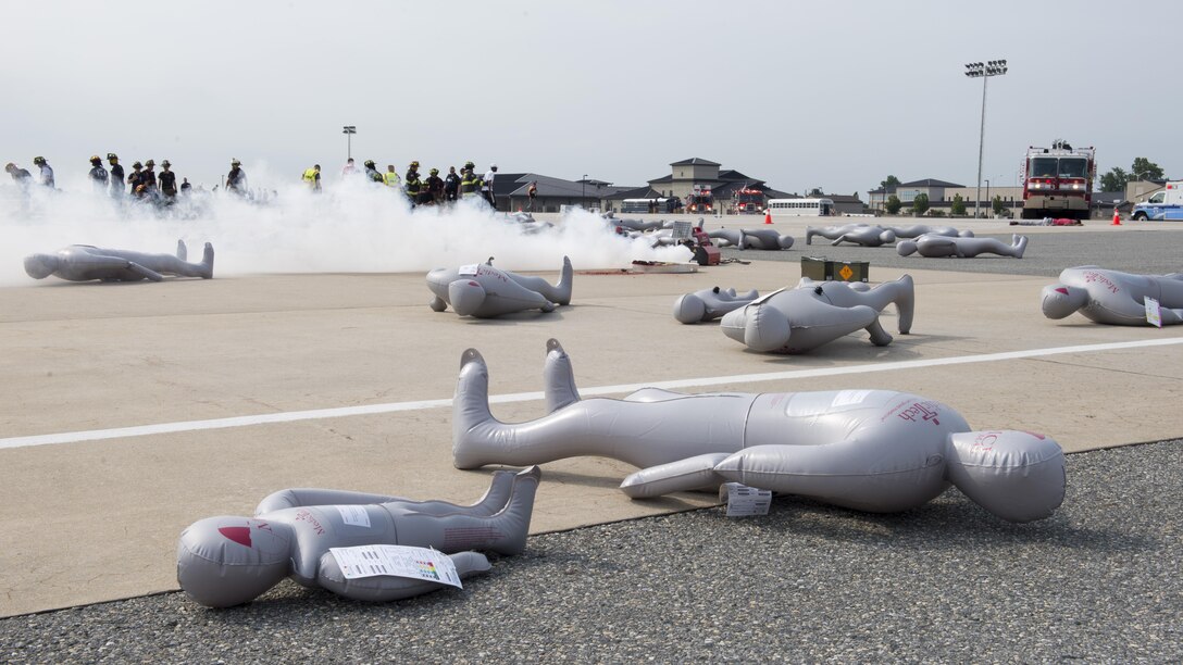 Inflatable simulated casualties lay on the flightline during a Major Accident Response Exercise July 22, 2017, on Dover Air Force Base, Del. The exercise simulated an aircraft accident resulting in more than 100 casualties. (U.S. Air Force photo by Senior Airman Zachary Cacicia)