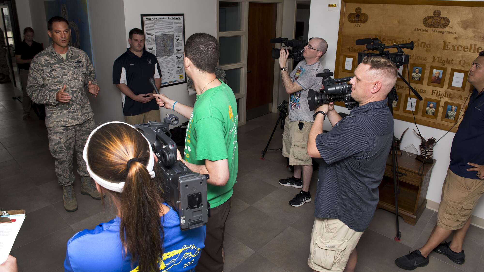 Col. Ethan Griffin, 436th Airlift Wing commander, conducts a mock press conference during a Major Accident Response Exercise July 22, 2017, on Dover Air Force Base, Del. This scenario was used to prepare the commander in media relations in the event that a press conference is needed. (U.S. Air Force photo by Senior Airman Zachary Cacicia)