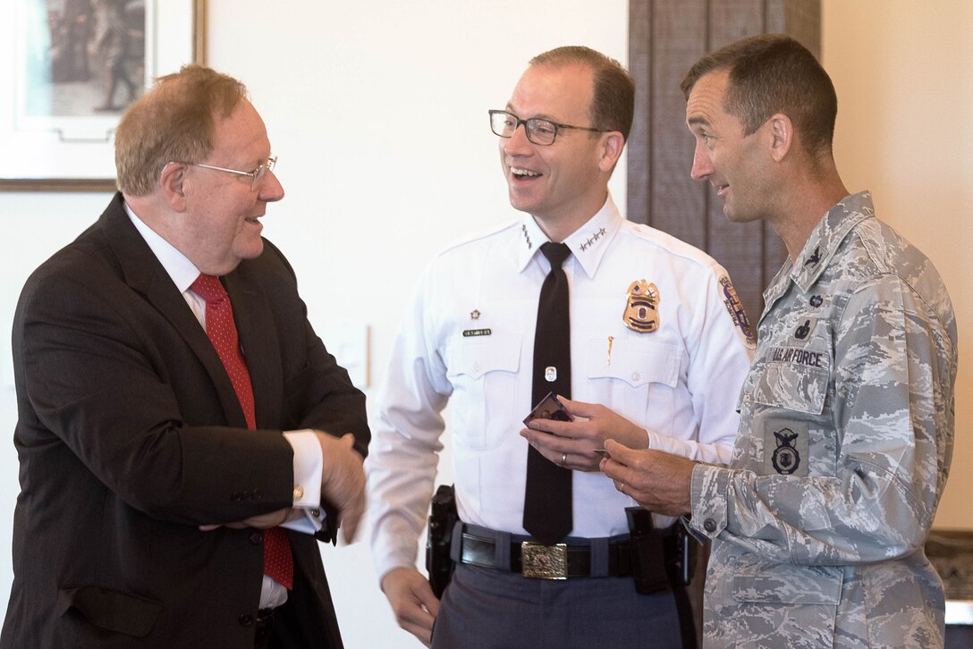 (Right to Left) Col. Troy Roberts, 11th Security Forces Group commander, speaks to Hank Stawinski, Prince George’s County police chief and Judge Phillip Nichols prior to the Joint Base Andrews 2017 Honorary Commander Immersion and Breakfast, July 25, 2017, at JBA, Md. The JBA Honorary Commander Program allows communication and partnerships between key leaders of the base and surrounding community. (U.S. Air Force photo by Senior Airman Delano Scott)
