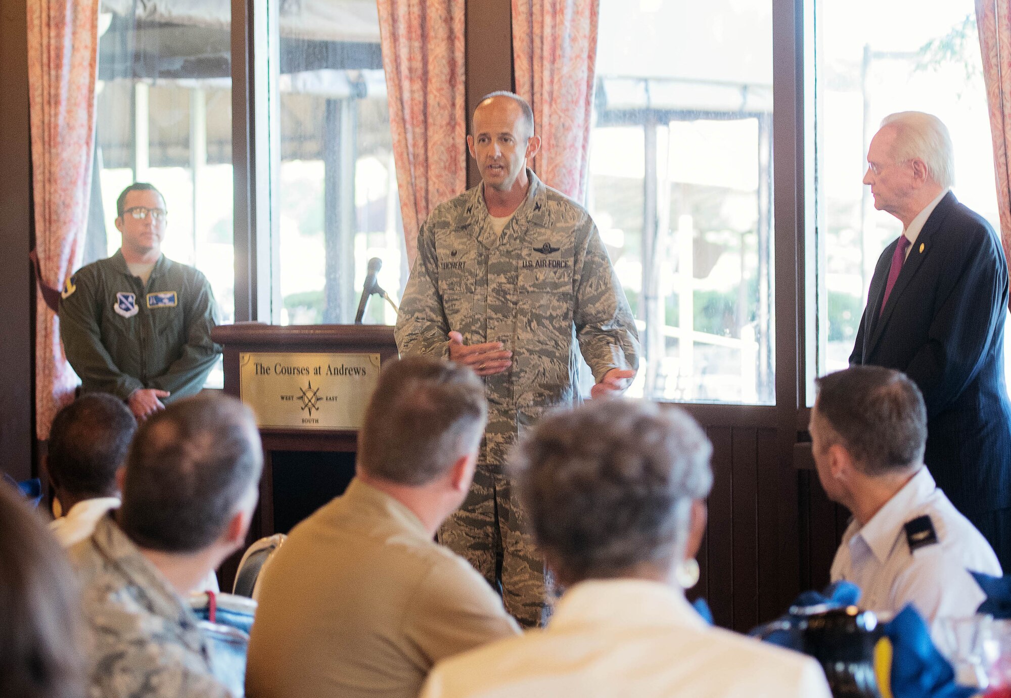 Col. John E. Teichert, 11th Wing and Joint Base Andrews commander, addresses attendees of the Joint Base Andrews 2017 Honorary Commander Immersion and Breakfast, July 25, 2017, at JBA, Md. During their time in the program, honorary commanders are invited to participate in various installation events like orientations, mission briefs, tours and air shows. (U.S. Air Force photo by Senior Airman Delano Scott)