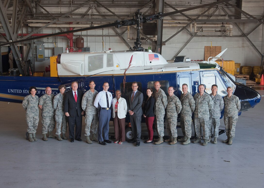 Members of the Joint Base Andrews Honorary Commander Program pose for a photo July 25, 2017 at JBA, Md. The JBA Honorary Commander Program encourages an exchange of ideas and experiences, as well as partnerships between key leaders of the base's surrounding communities, JBA commanders and Airmen. (U.S. Air Force photo by Senior Airman Delano Scott)