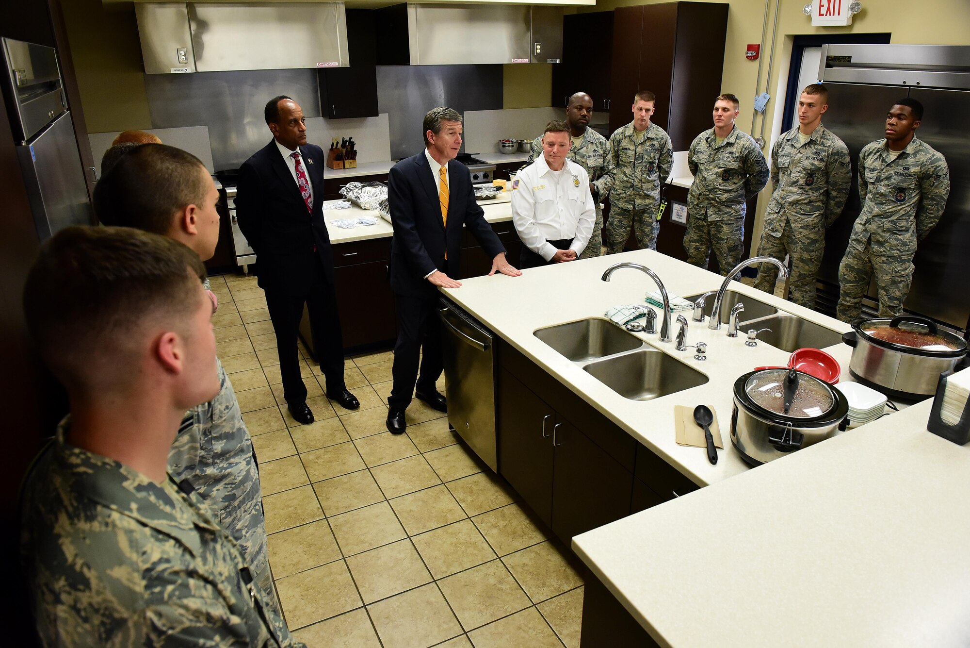 North Carolina Governor Roy Cooper addresses Airmen from the 4th Civil Engineer Squadron fire department before a luncheon, July 19, 2017, at Seymour Johnson Air Force Base, North Carolina. During the luncheon, Sean Quinby, 4th CES fire chief, met with Cooper and discussed the fire department’s mission and recent achievements, which include firefighters’ heroic actions during Hurricane Matthew. (U.S. Air Force photo by Airman 1st Class Kenneth Boyton)