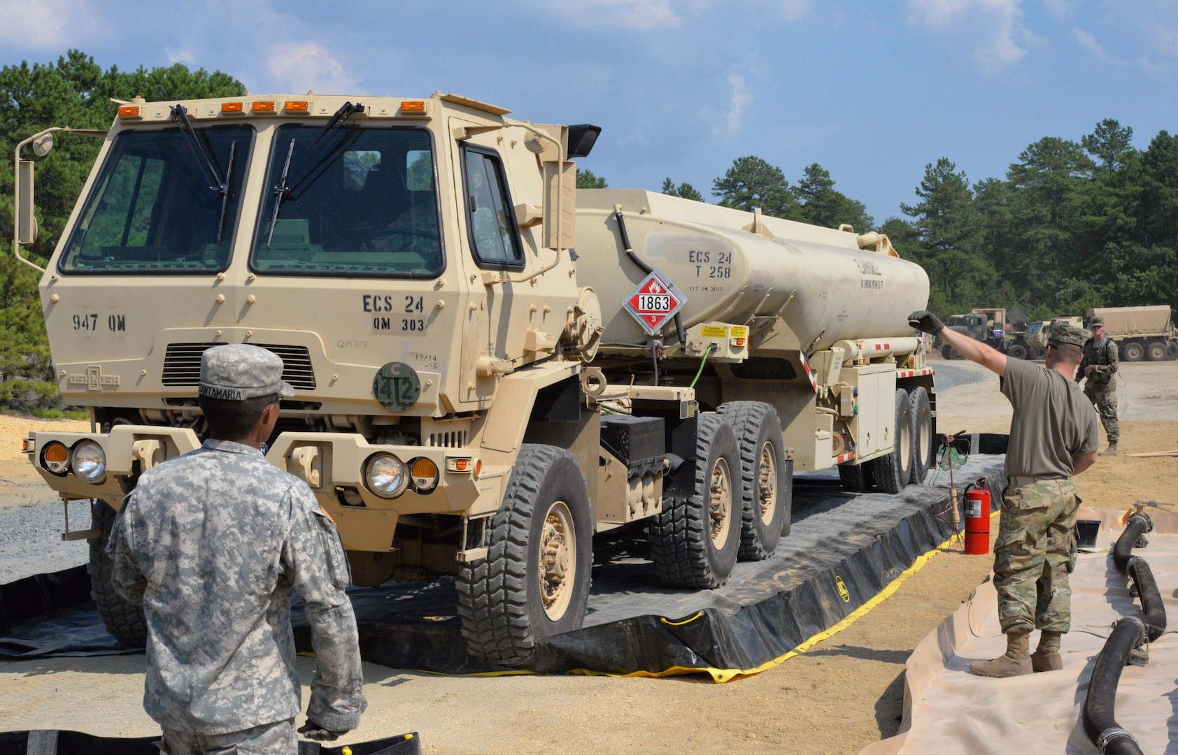 Soldiers with the 947th Quartermaster Company, Chambersburg, PA, receive a fuel truck at a fuel system supply point July 19, 2017, at Joint Base McGuire-Dix-Lakehurst, N.J., during a Quartermaster Liquid Logistic Exercise. The exercise tested the Soldiers capability to safely and efficiently receive incoming fuel trucks and download thousands of gallons fuel. Once the fuel was received, the Soldiers cleaned and recirculated it before refilling trucks awaiting resupply. 