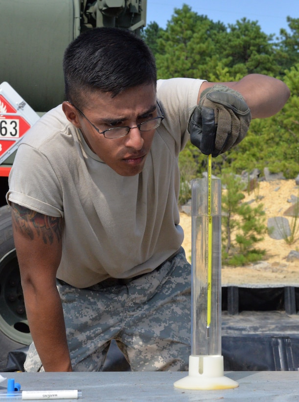 Army Sgt. Benjamin Santa Maria, 947th Quartermaster Company, tests the temperature and density of fuel at a fuel system supply point during a Quartermaster Liquid Logistic Exercise at Joint Base McGuire-Dix-Lakehurst, N.J., July 19, 2017. QLLEX is a multicomponent operation that allows reserve units to conduct real-world petroleum and water purification support in a combat training environment.