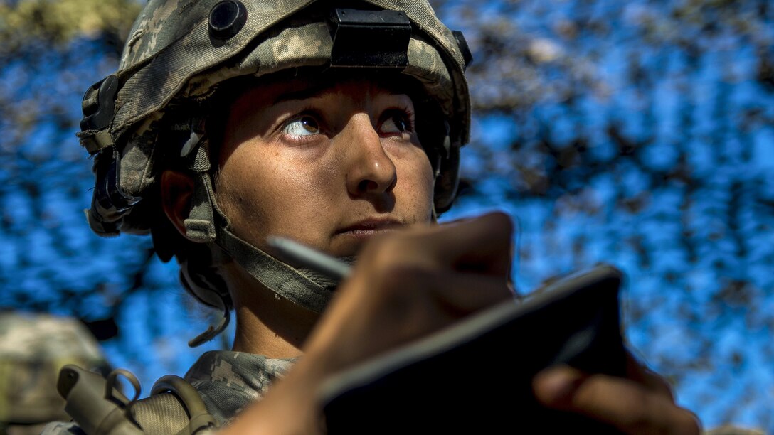 Army Sgt. Jazmyn Medina, a reservist assigned to the 56th Military Police Company, takes notes for a mission during a combat support training exercise at Fort Hunter Liggett, Calif., July 22, 2017. Army Reserve photo by Master Sgt. Michel Sauret